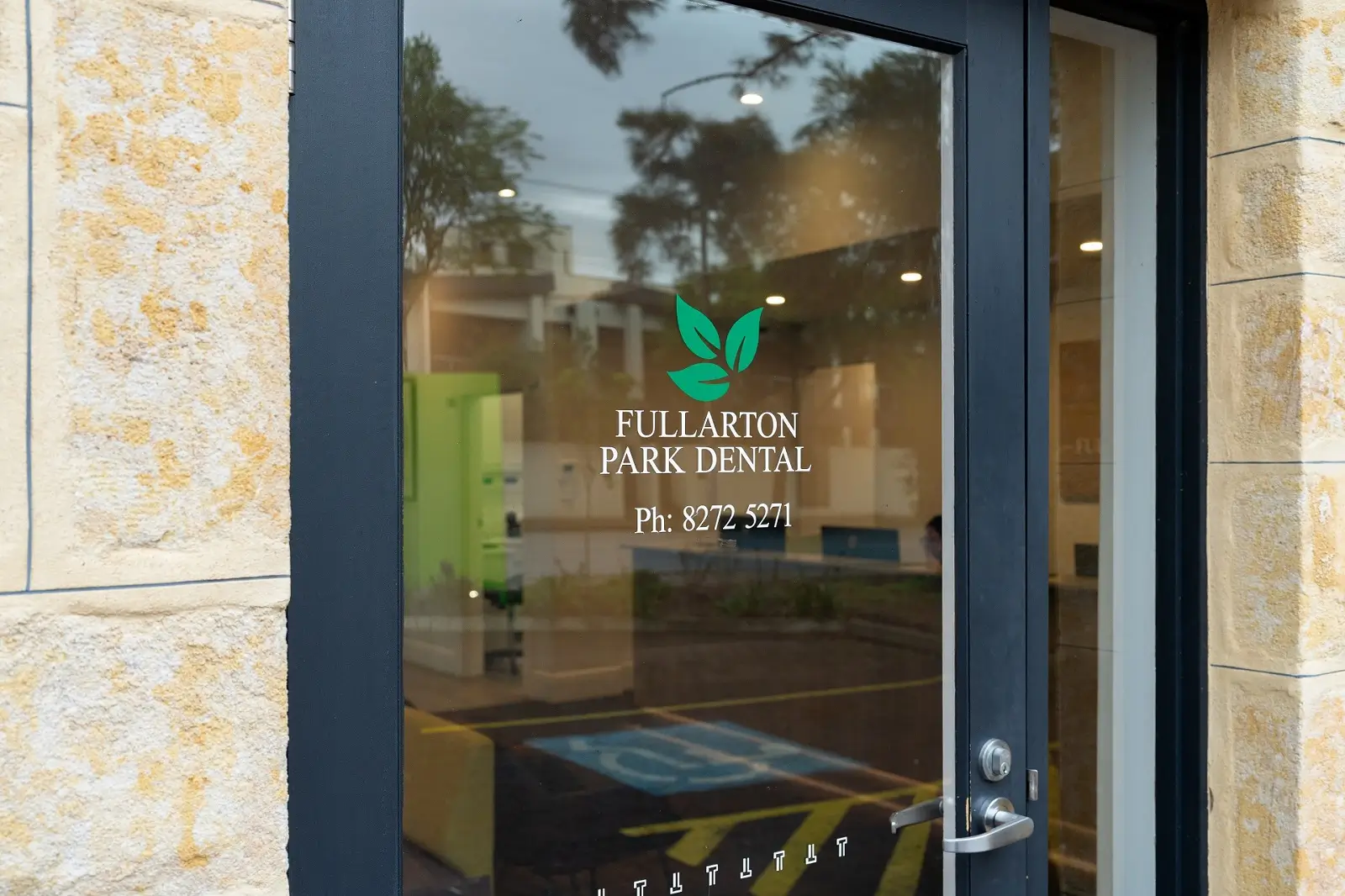 Front door of Fullarton Park Dental with the practice logo and phone number